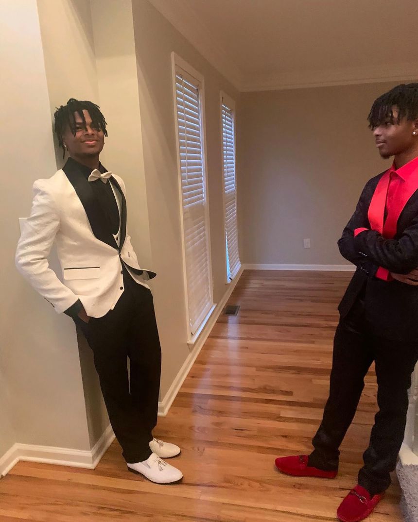 Naazir Lewis, left, and his twin brother Qaadir in an undated photo. The twins were snappy dressers.