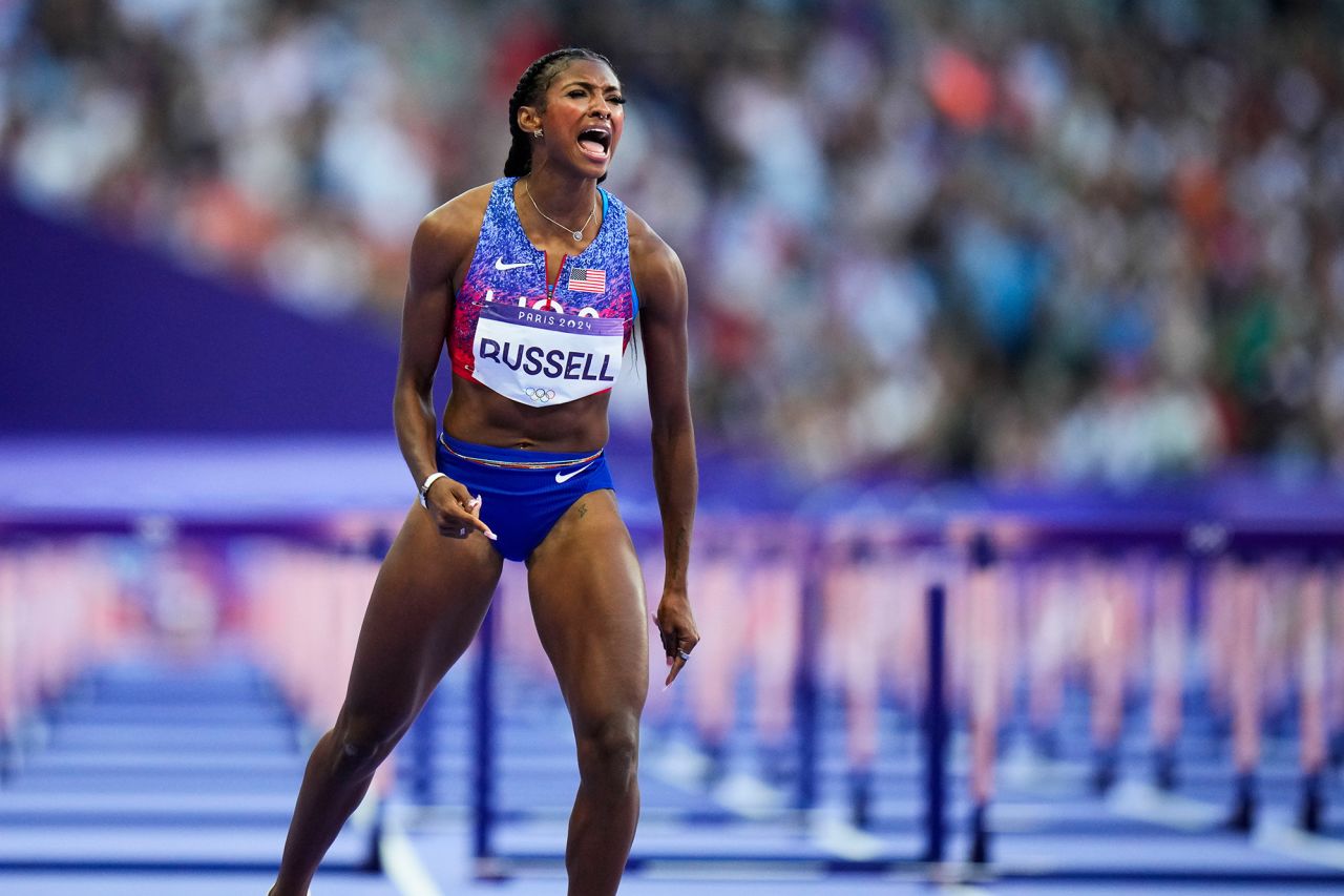 USA’s Masai Russell celebrates after winning the women's 100-meter hurdles final on August 10. 