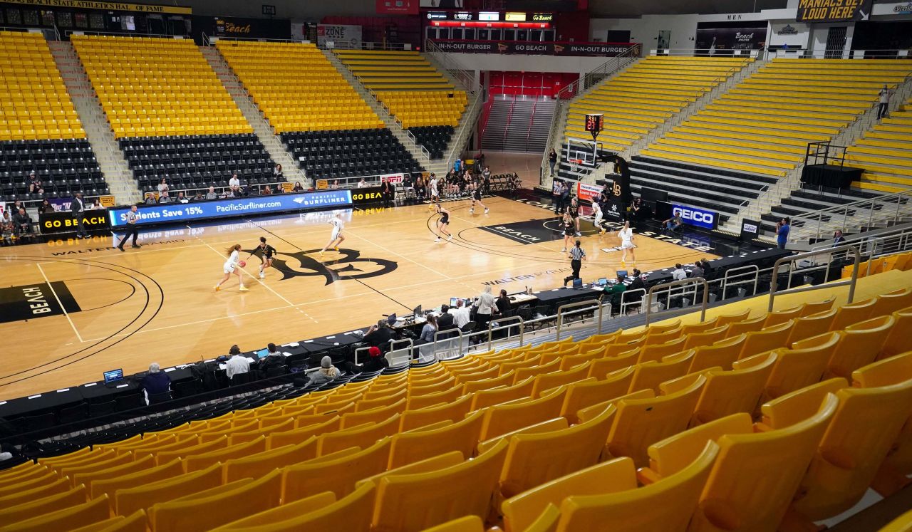 The Long Beach State and Cal Poly women's basketball teams play in an empty Walter Pyramid arena during the Big West tournament in Long Beach, California on March 10.