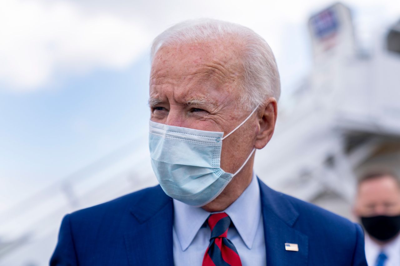 Democratic presidential candidate Joe Biden speaks to members of the media before boarding his campaign plane at New Castle Airport in New Castle, Delaware, on October 5.