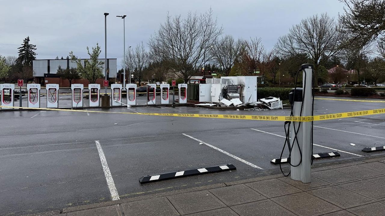 This photo from the Lacey Police Department shows a damaged Tesla charging station in Lacey, WA.