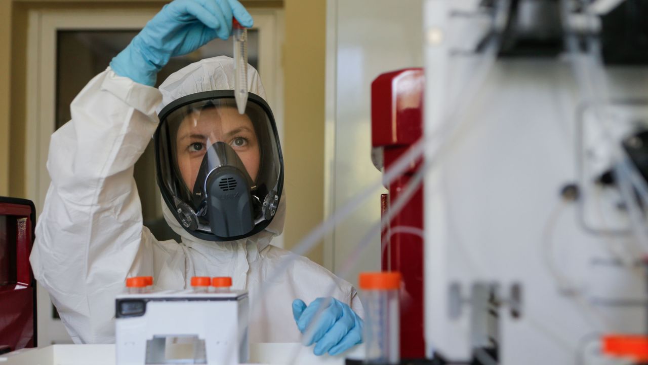 An employee works with a coronavirus vaccine in this photo provided by the Russian Direct Investment Fund on August 6.