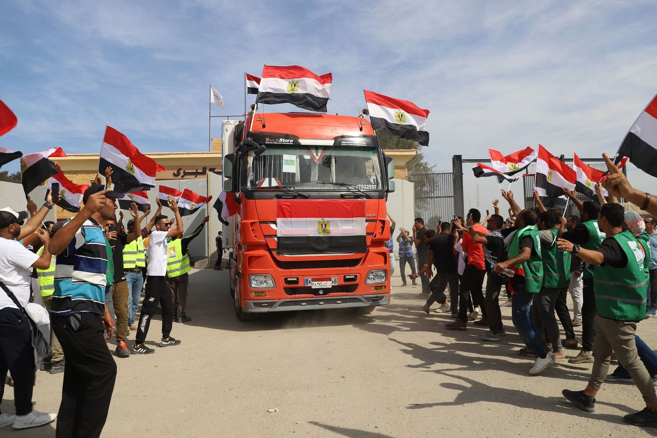 Workers celebrate as an aid truck returns to Egypt from Gaza on October 21.