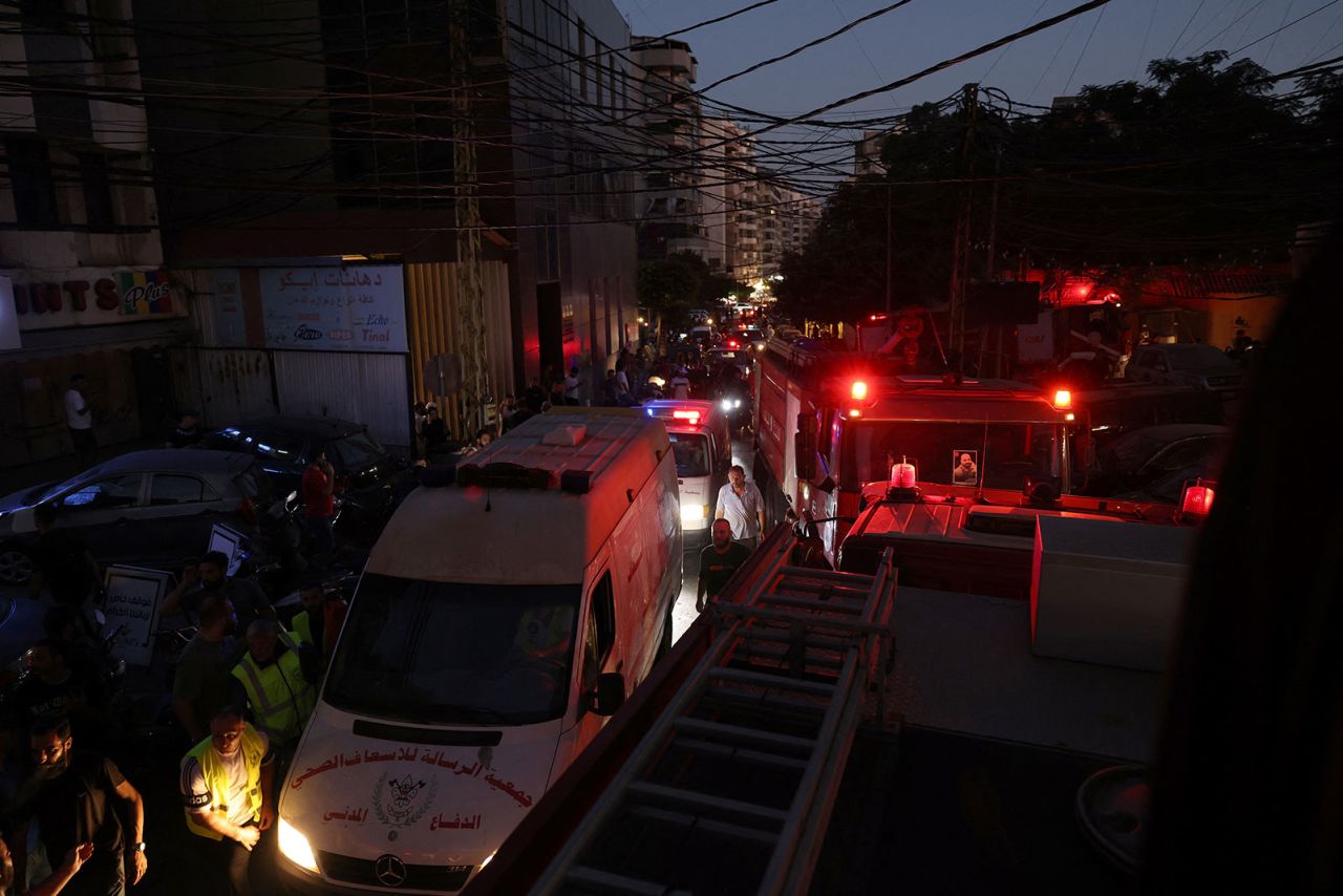 Rescue services arrive near the site of an Israeli military strike on Beirut's southern suburbs on July 30.