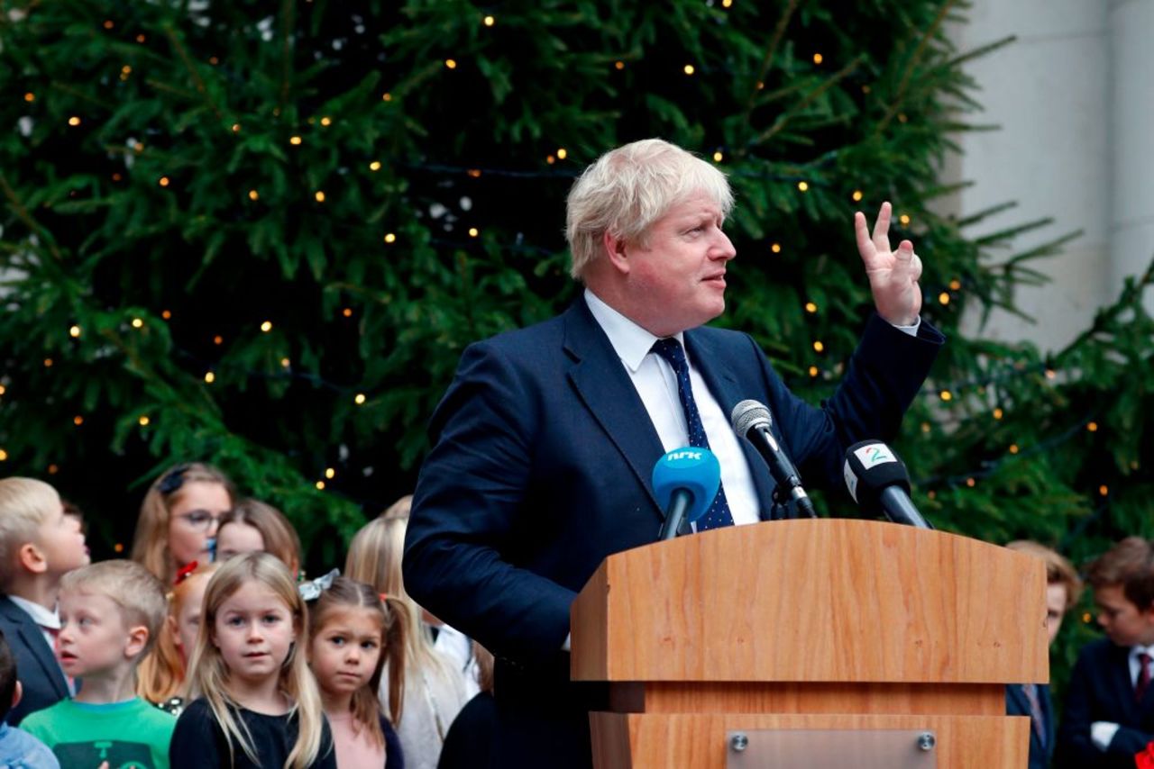 Boris Johnson unveils a Christmas tree at the Foreign Office in 2017.