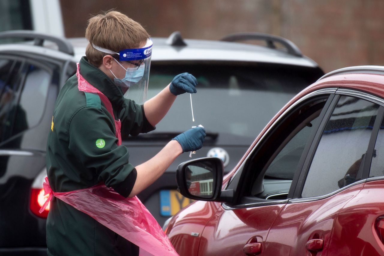 A health worker takes a swab from a person on January 11 in Bristol, England.