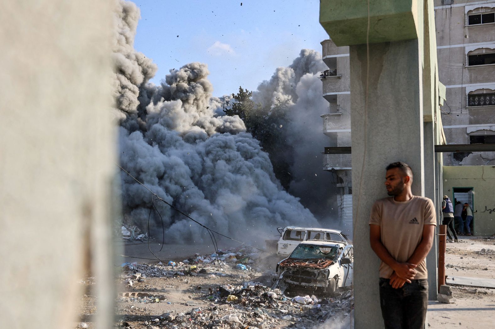 A man takes cover from an Israeli strike on the outskirts of Gaza City on September 1.