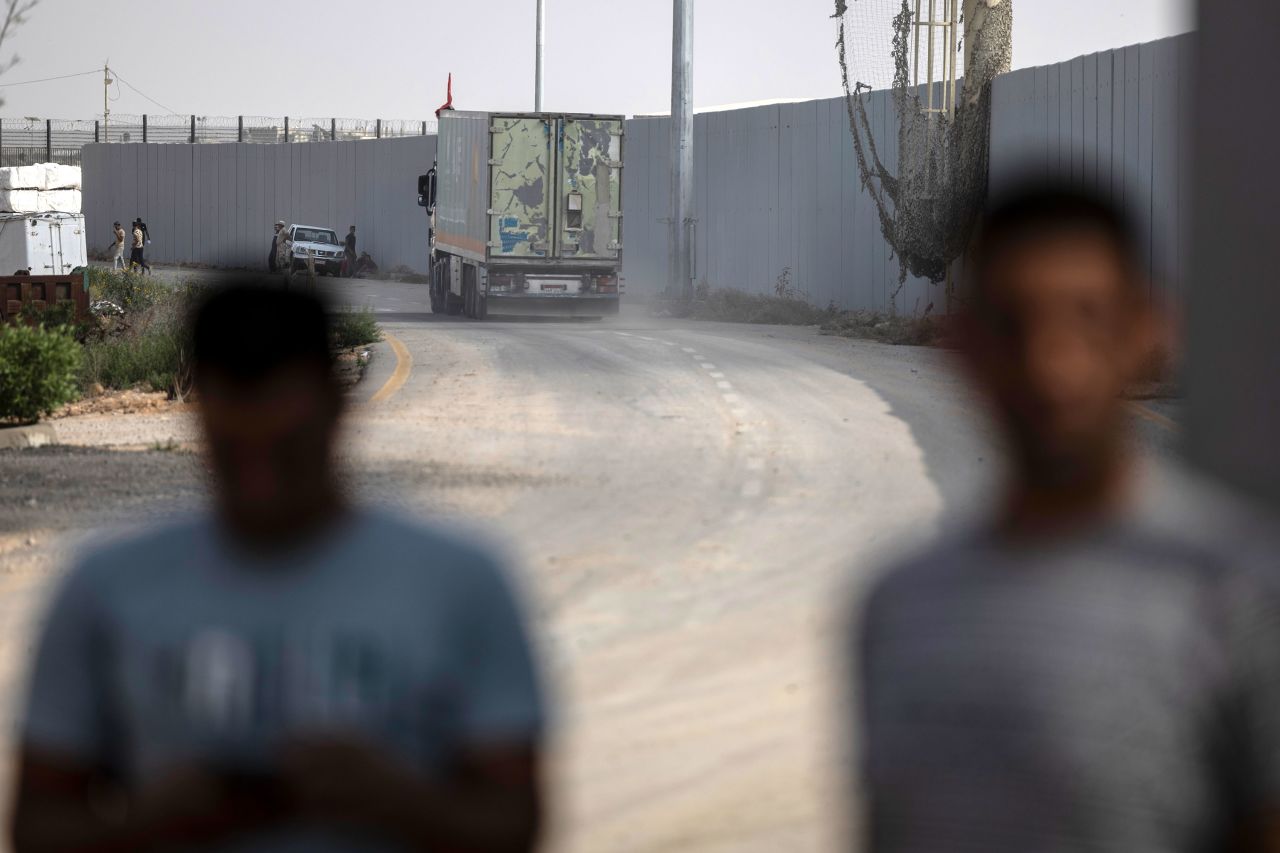 The second convoy of aid trucks crosses the Rafah border from the Egyptian side in North Sinai, Egypt, on Sunday.