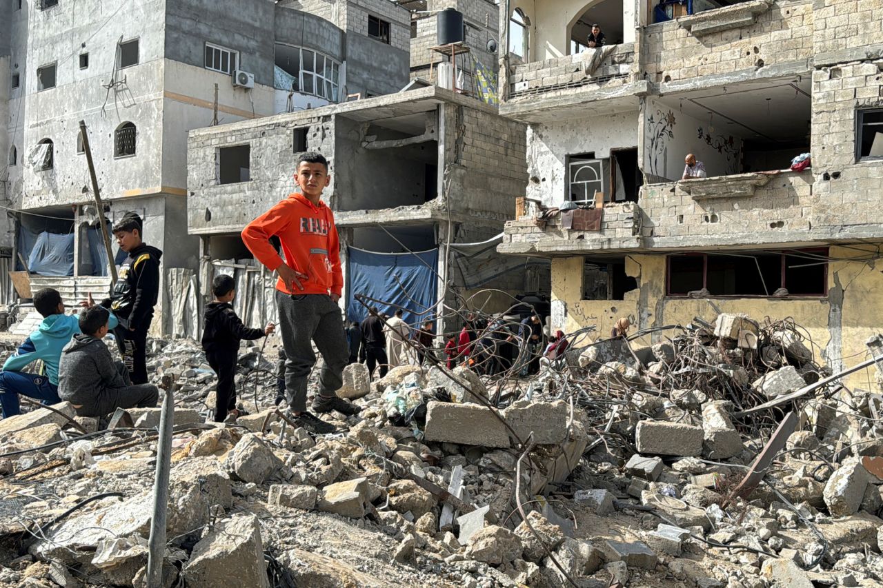 Palestinian children gather on the site of an Israeli strike in Rafah, Gaza, on March 27.