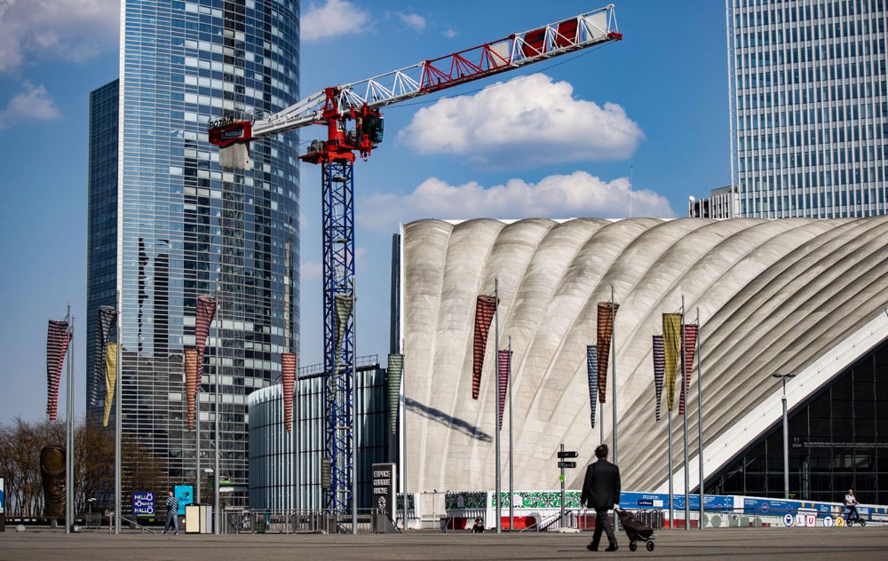 A man walks on a street in the business district of La Defense in downtown Paris, France, on April 8.