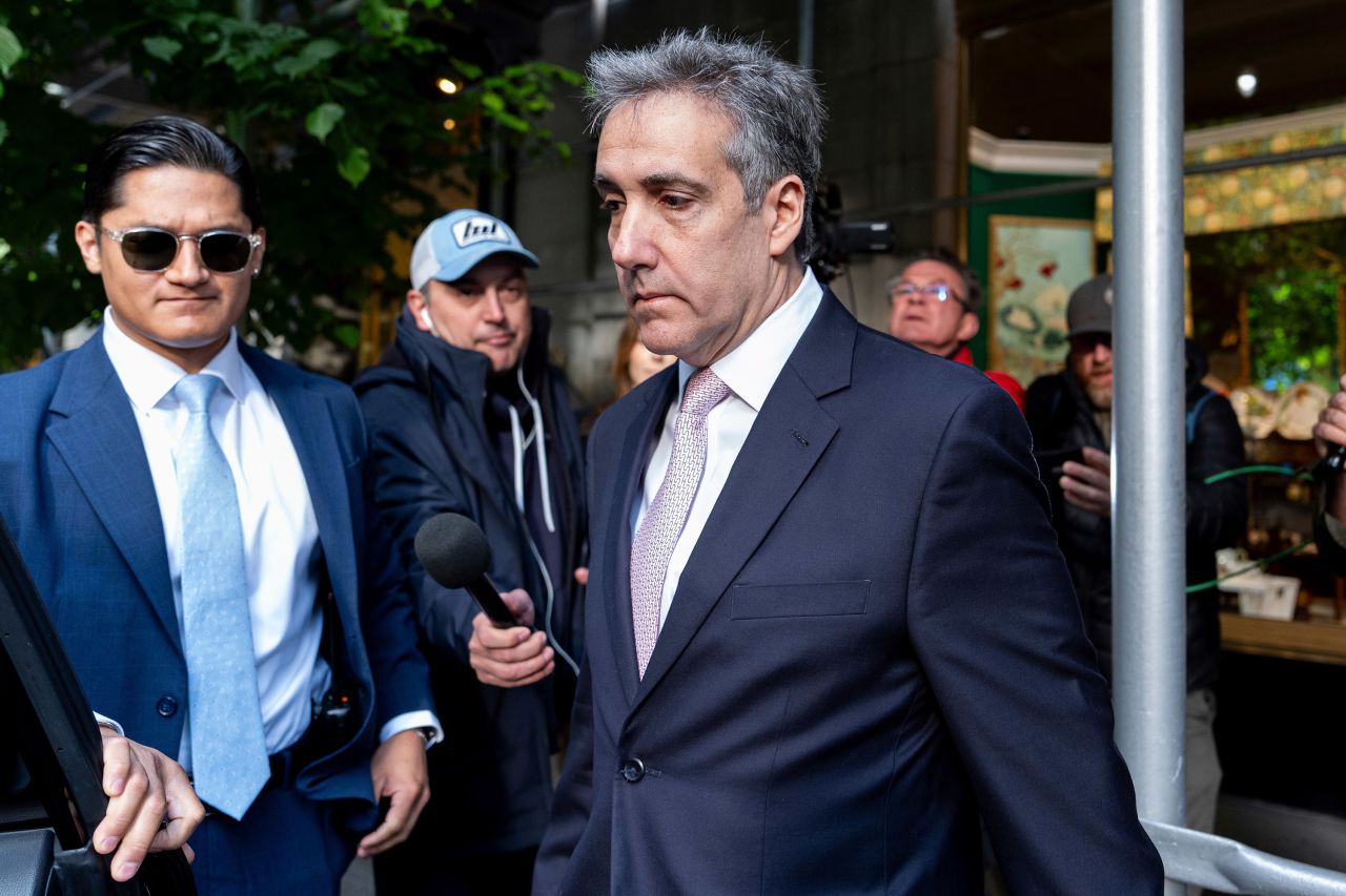 Michael Cohen leaves his apartment building in New York on his way to Manhattan criminal court on Monday.