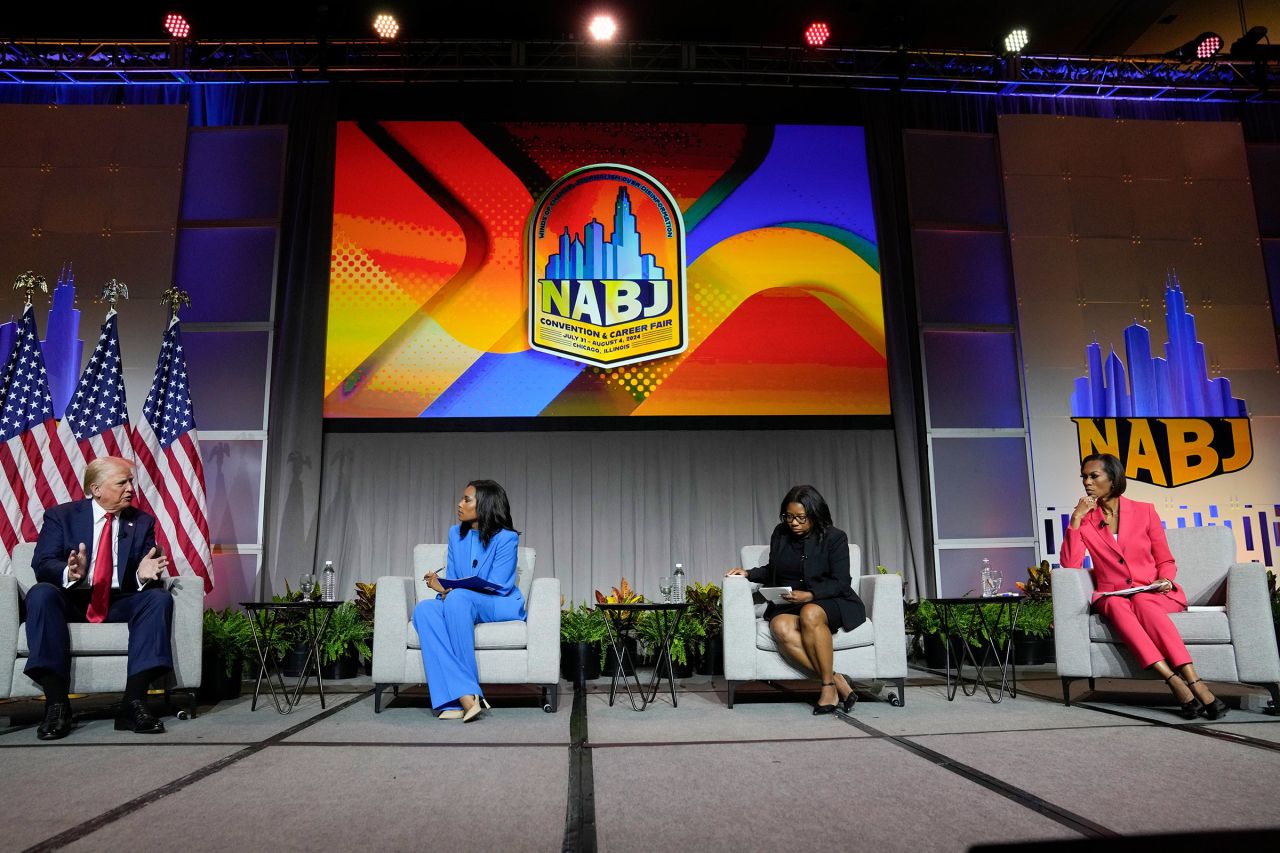 Former President Donald Trump, left, moderated by from left, ABC's Rachel Scott, Semafor's Nadia Goba and FOX News' Harris Faulkner, speaks at the National Association of Black Journalists, NABJ, convention on Wednesday, July 31, 2024, in Chicago.