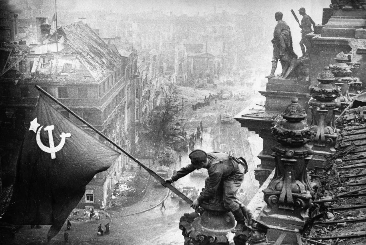 Red army soldiers raising the soviet flag over the Reichstag in Berlin, Germany, on April 30, 1945.
