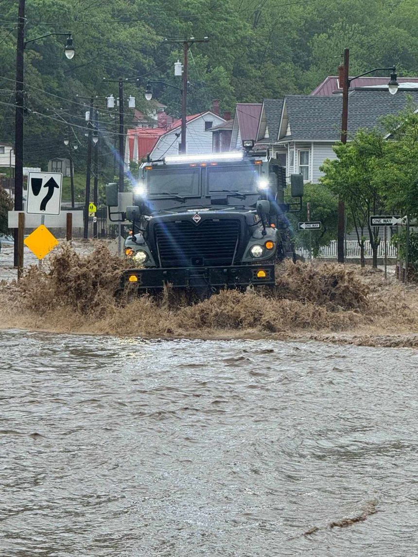 Cumberland Police vehicle navigates through extreme floodwaters on Tuesday, May 13, 2025.
