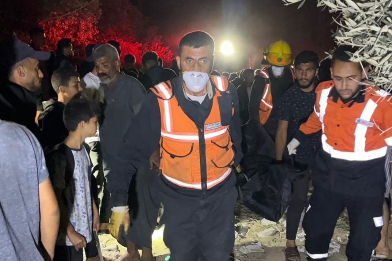 Civil defense teams transport several injured people following Israeli attacks in Rafah, southern Gaza.