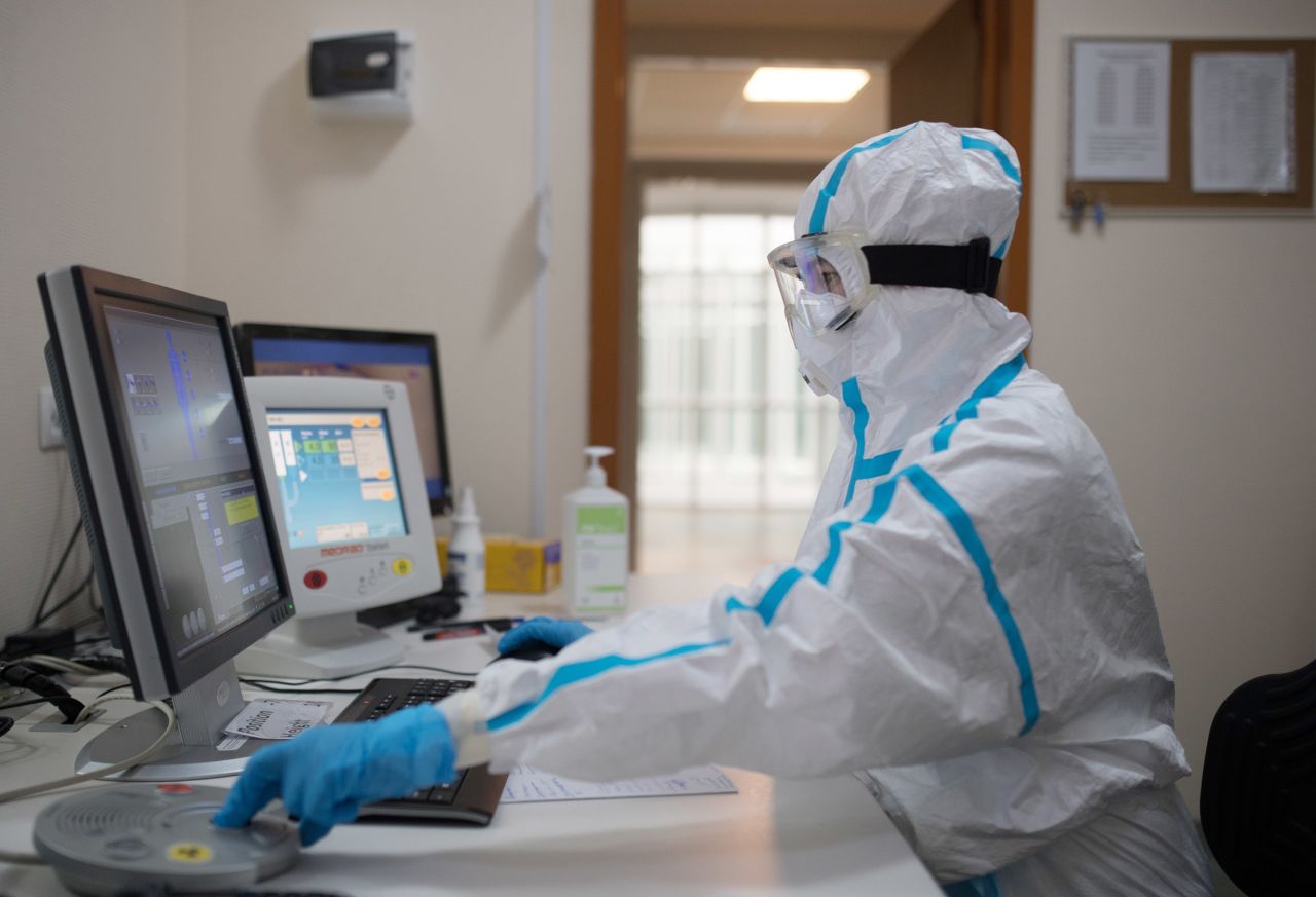 A health care provider makes a computer tomography (CT) of a patient at Lomonosov Moscow State University's Clinic, where coronavirus patients are being treated.