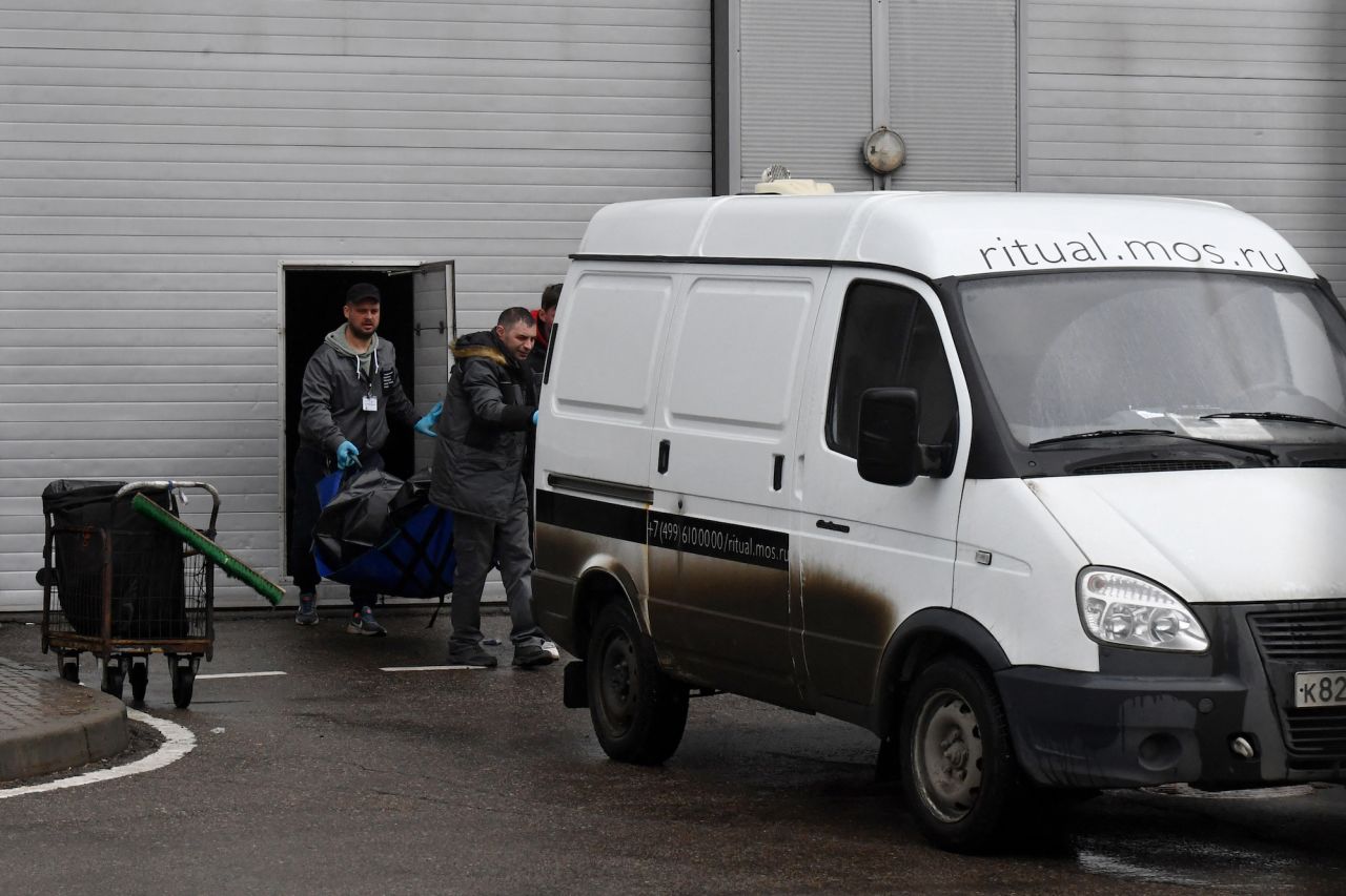 Law enforcement officers carry out the body of a victim at the Crocus City Hall in Krasnogorsk, outside Moscow, on Saturday.