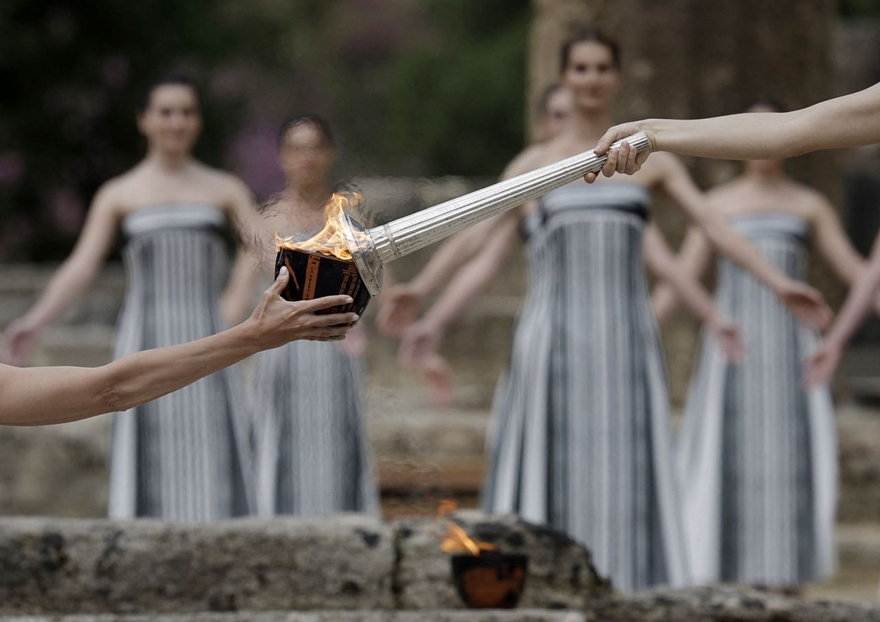 Greek actress Mary Mina, playing the role of High Priestess, lights the flame during the Olympic Flame lighting ceremony for the Paris 2024 Olympics in Ancient Olympia, Greece, on April 16, 2024.