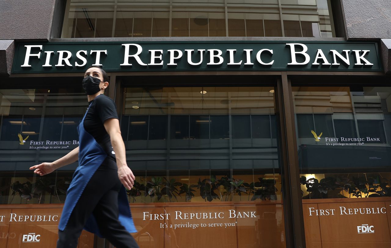 A person walks by the First Republic Bank headquarters on March 13 in San Francisco, California.?