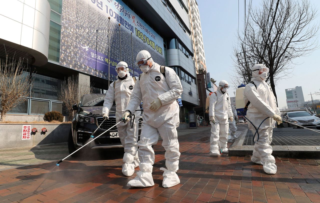 Workers spray disinfectant in Daegu, South Korea on Thursday.