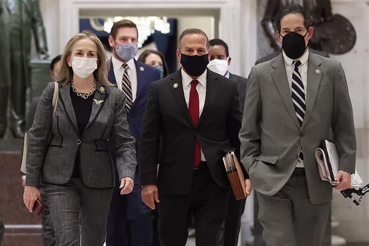  Impeachment managers Rep. Madeleine Dean, Rep. Eric Swalwell, Rep. David Cicilline,  and Rep. Jamie Raskin walk through Statuary Hall on Wednesday, January 13.