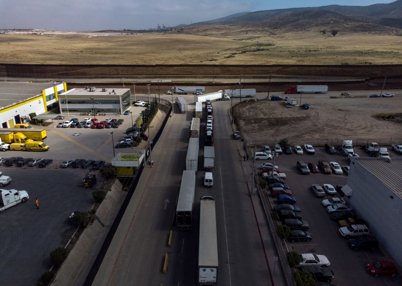Aerial view of cargo trucks heading to the United States lining up near the commercial port of entry in Otay, in Tijuana, Baja California state on May 30, 2019.