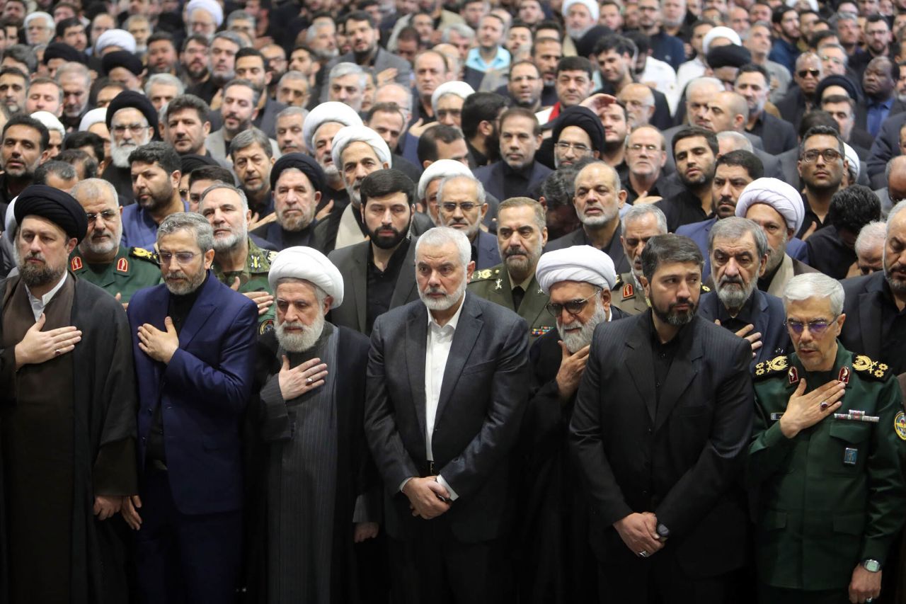 Hamas political leader Ismail Haniyeh, center, attends a funeral prayer for the late Iranian President Ebrahim Raisi in Tehran, Iran, on May 22. 