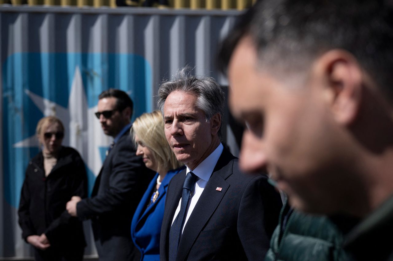 US Secretary of State Antony Blinken (C) leaves after his visit to an agricultural logistics and transshipment facility in Vyshneve, Kyiv region, on May 15. The United States will back Ukraine until the country's security is "guaranteed," US Secretary of State Antony Blinken said in a speech in Kyiv on May 14.