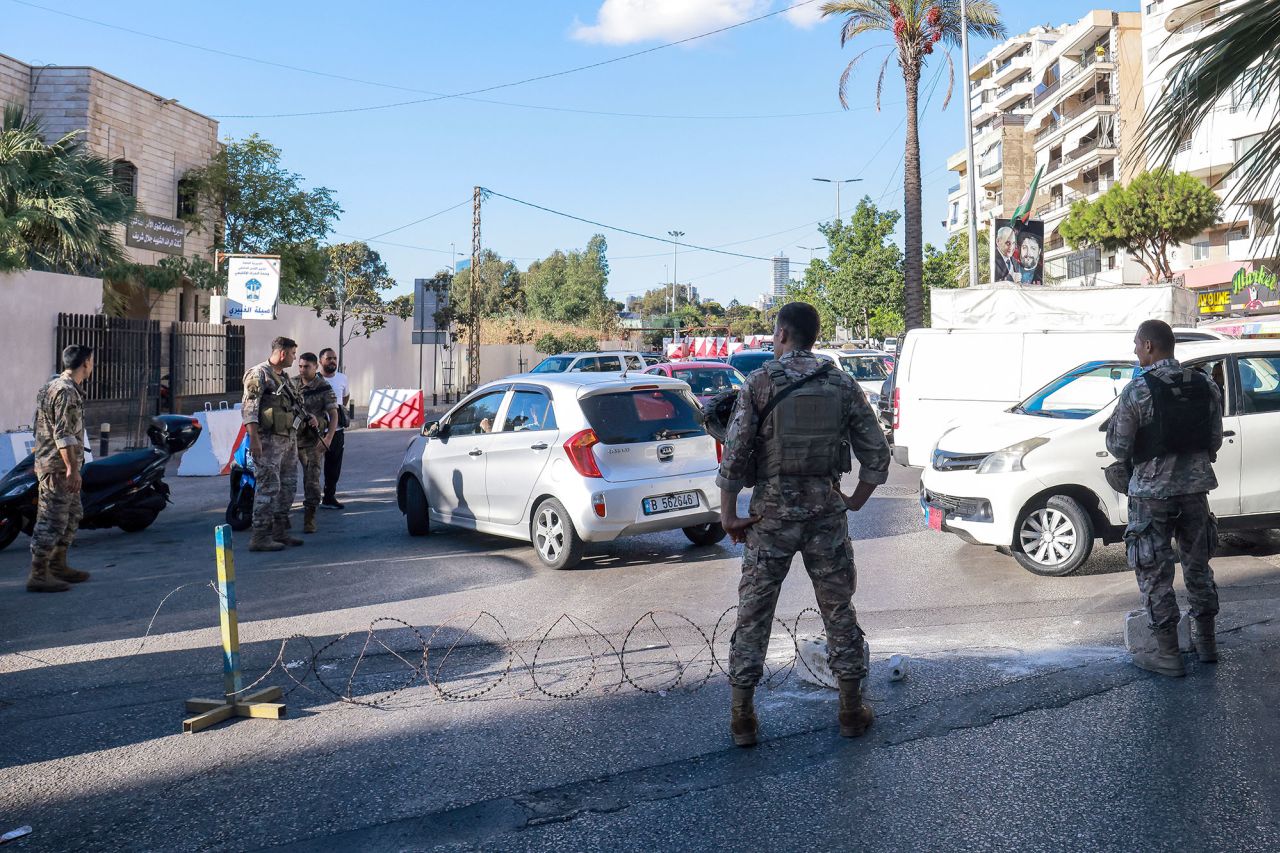 Lebanese army soldiers block an entrance of a Beirut southern suburb on September 17, after explosions hit locations in several Hezbollah strongholds.