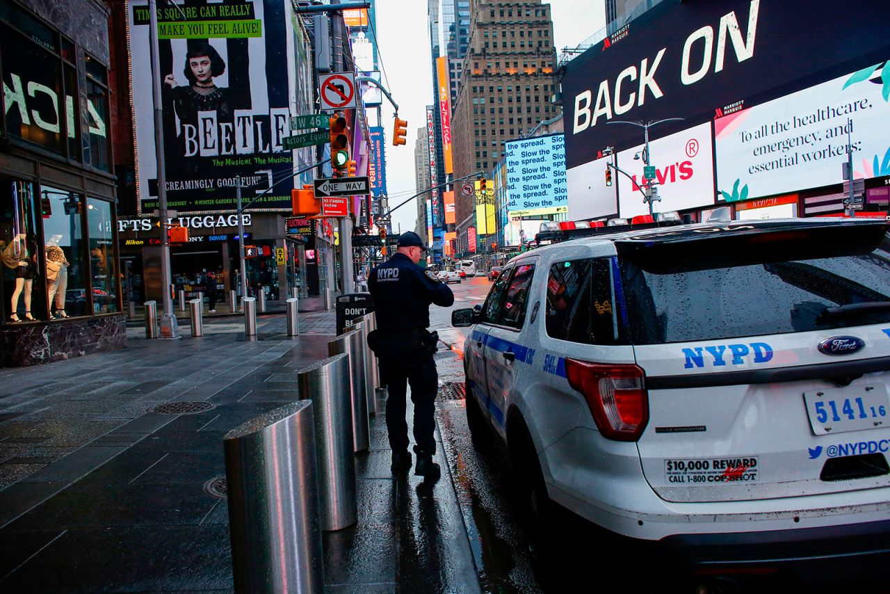 A New York police officer patrols Times Square on March 28.