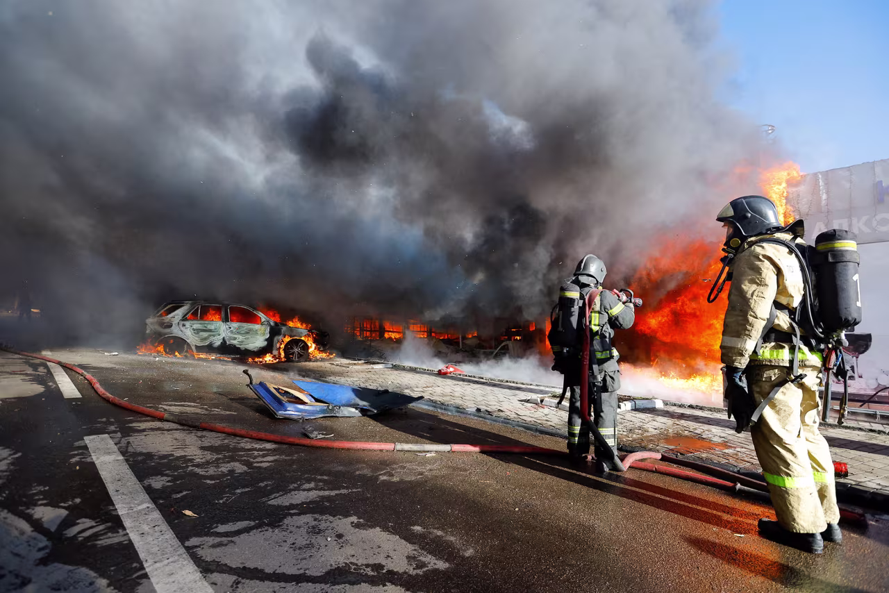 Firefighters work to extinguish a fire at market stalls hit by shelling in Donetsk, in Russian-controlled Ukraine, on December 6.