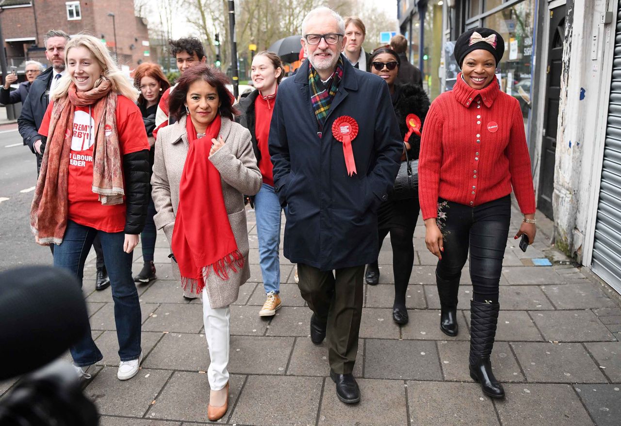 Britain's main opposition Labour Party leader Jeremy Corbyn walks to a polling station to cast his vote in north London.