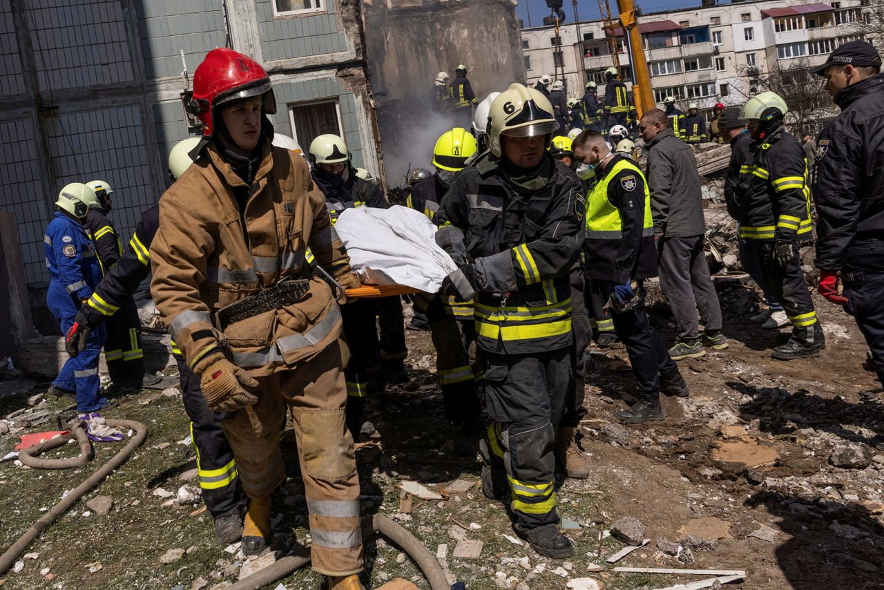 Rescuers carry a covered body as they work at the site of a heavily damaged residential building in the town of?Uman, Cherkasy region, Ukraine, on April 28.