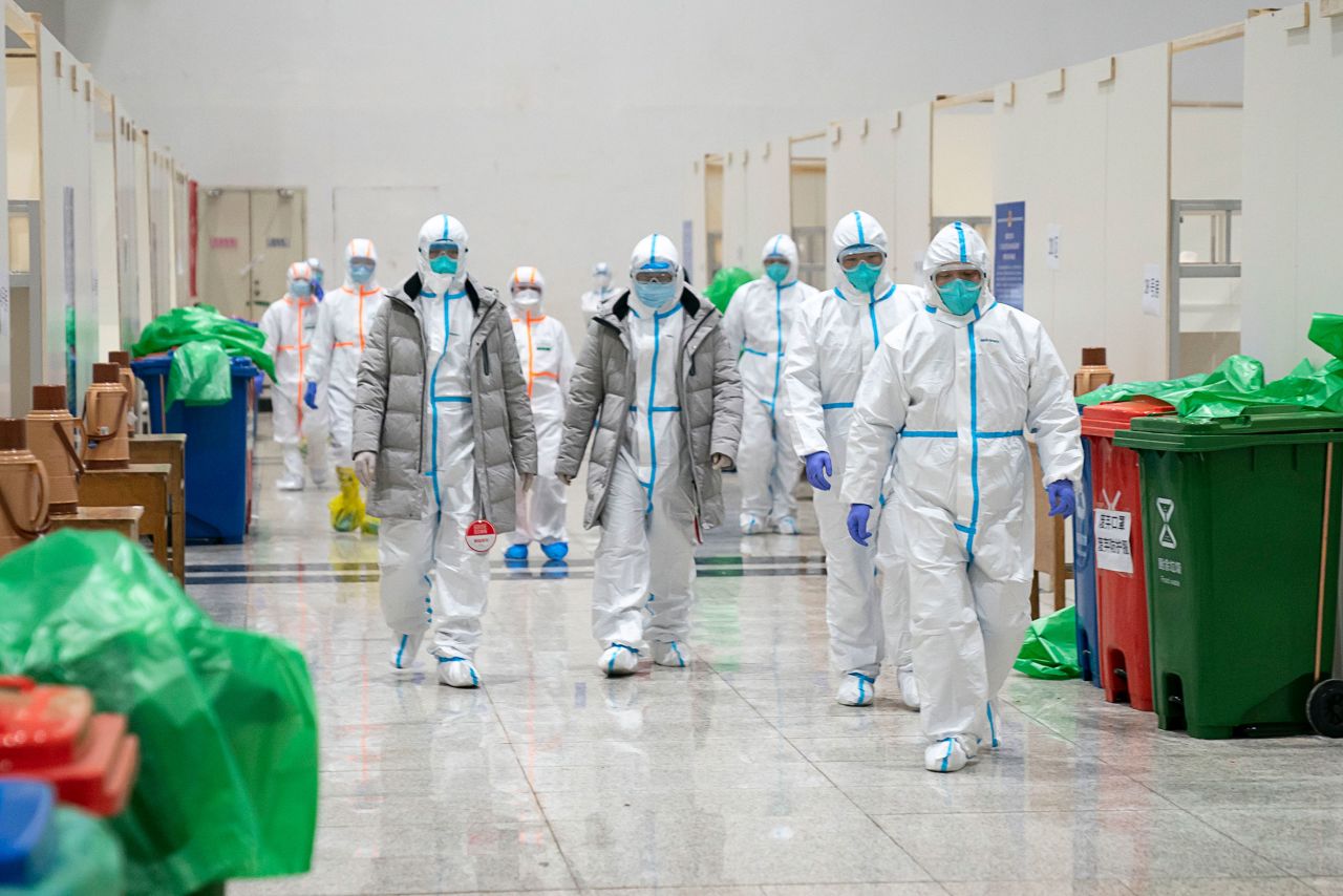 Medical staff walk through a makeshift hospital in Wuhan, China, on February 5.