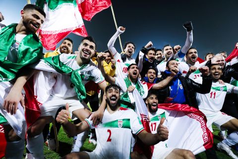 Iranian footballers celebrate after their victory in the FIFA World Cup Qualifier match between Iran and Iraq at Azadi Stadium on January 27, 2022 in Tehran, Iran. 