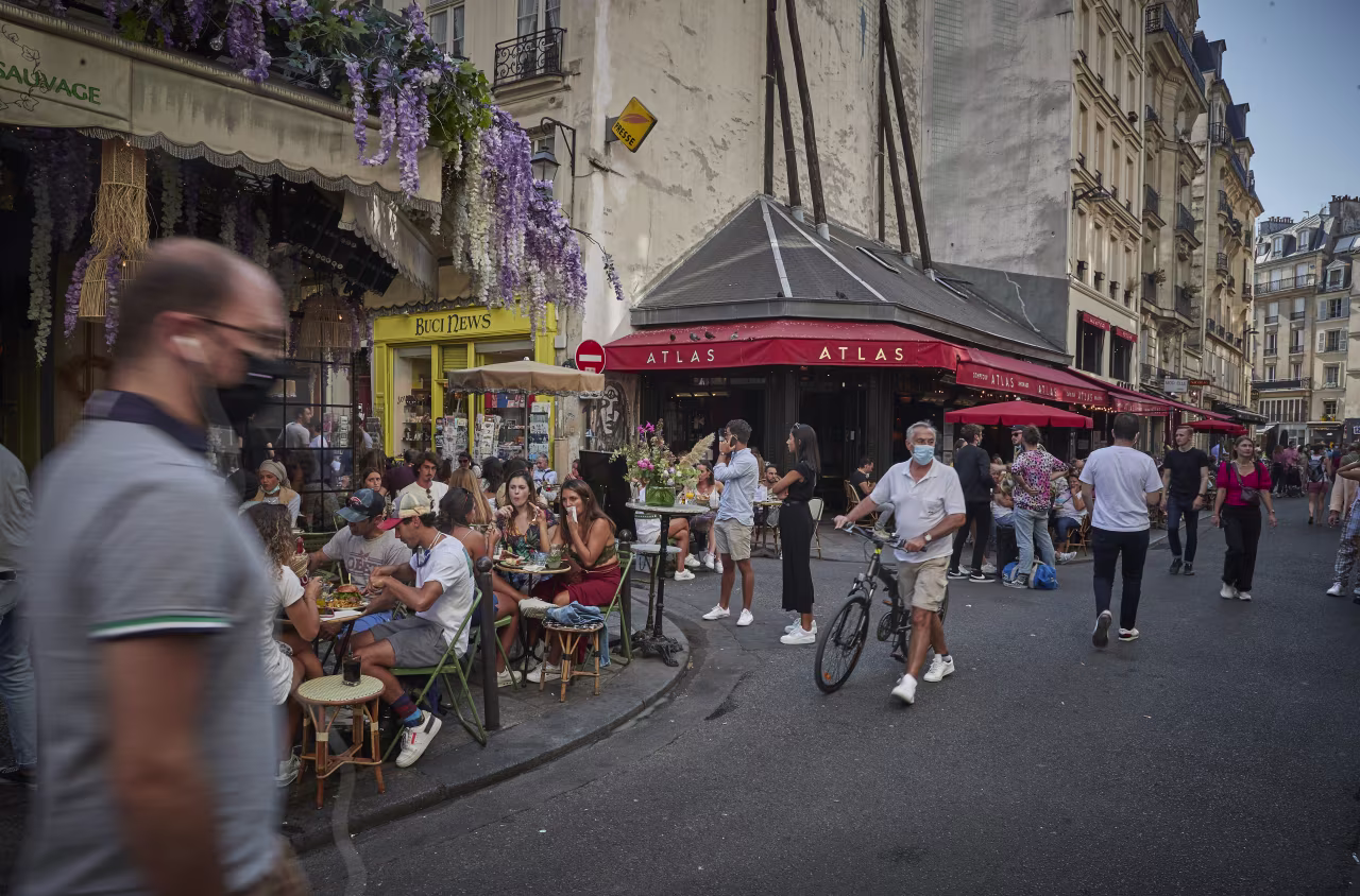 Parisians enjoy the late summer weather in packed cafes and restaurants on the Rue de Buci, Paris, despite the recent surge in Covid-19 infections throughout Paris and France on September 13.