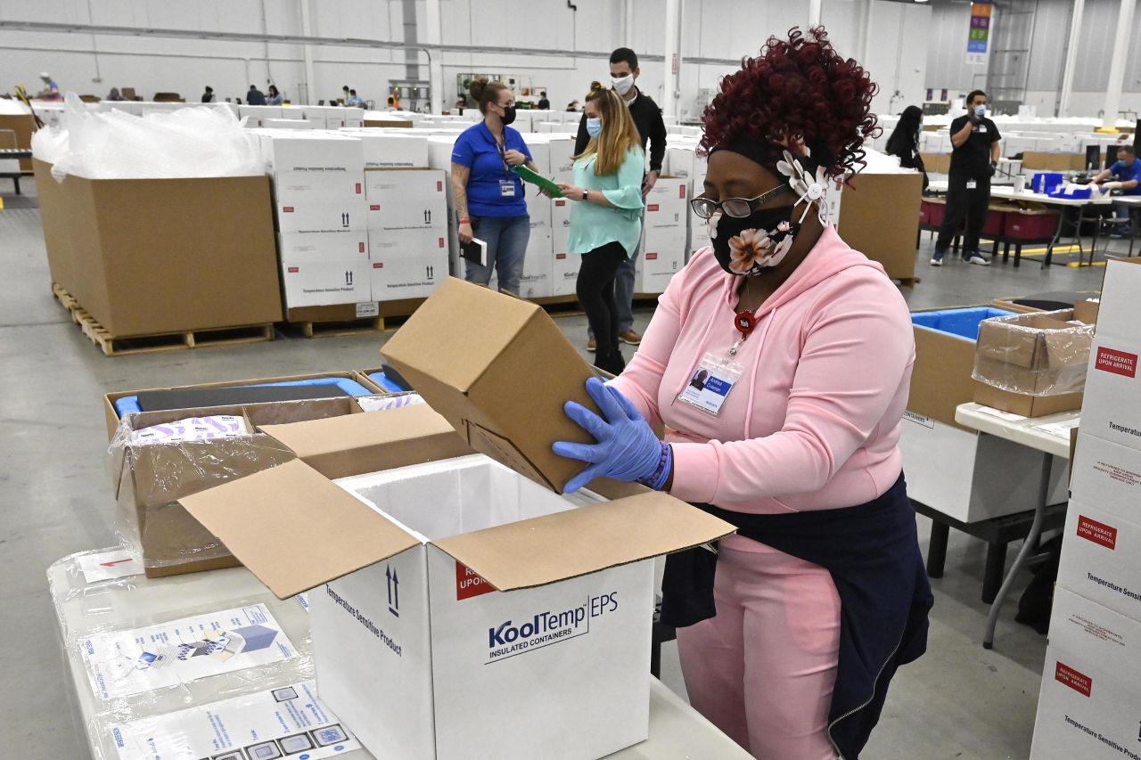 An employee packs a box of the Johnson & Johnson Covid-19 vaccine into a cooler for shipping from pharmaceutical distributor McKesson Corporation's facility, in Shepherdsville, Kentucky, on March 1. 