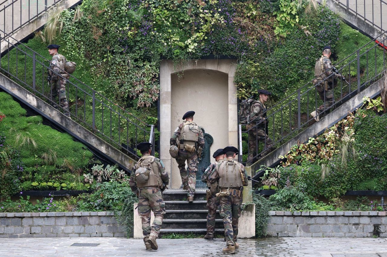 Military personal deploy near Pont d'Austerlitz in Paris on Friday.