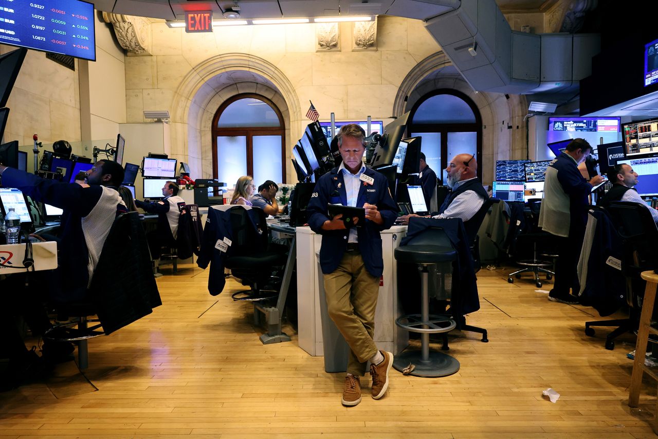 Traders work on the floor of the New York Stock Exchange during afternoon trading on August 5.