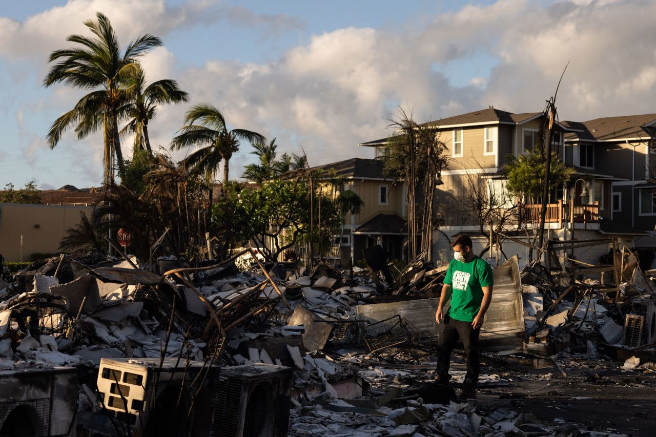 A Mercy Worldwide volunteer makes a damage assessment of an apartment complex in Lahaina, Hawaii, on Saturday.