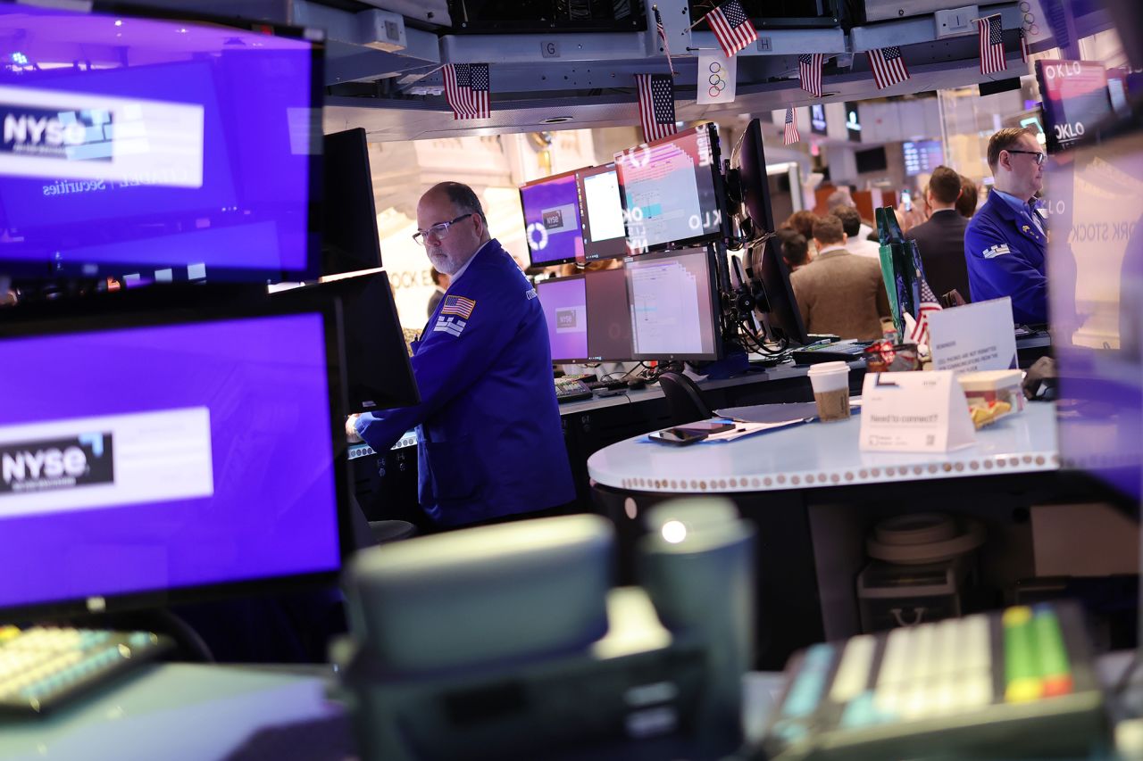 Traders work on the floor of the New York Stock Exchange during morning trading on May 24.