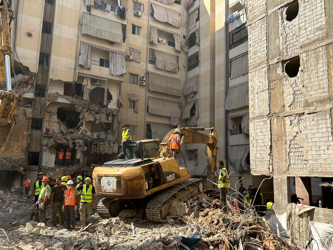 Rescue workers remove the rubble of the collapsed building on Saturday afternoon. At that point there was little hope to find survivors. 