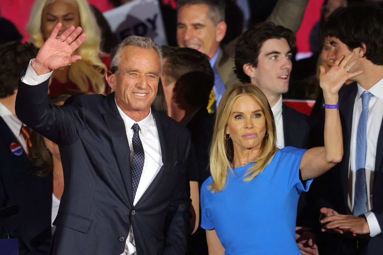 Robert F. Kennedy Jr. and his wife and actor Cheryl Hines wave to the crowd after Kennedy announced his candidacy for the Democratic presidential nomination in Boston, Massachusetts, on April 19, 2023.