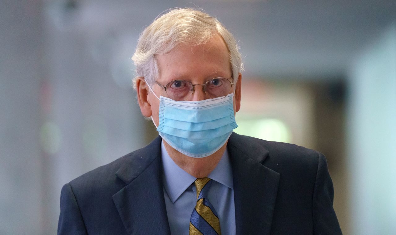 Senate Majority Leader Mitch McConnell arrives to meet with reporters at the Capitol on September 22 in Washington, DC.