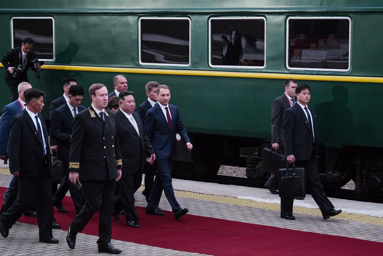 North Korea's leader Kim Jong Un is welcomed by Russia's Minister of Natural Resources and Environment Alexander Kozlov at Khasan train station on September 12.