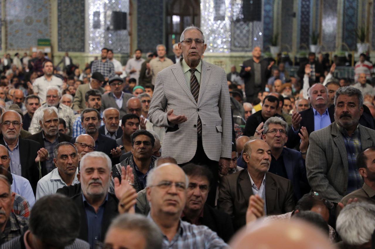 In this photo from ShahraraNews, people pray for Iranian President Ebrahim Raisi at the Imam Reza shrine in Mashhad, Iran, on May 19.