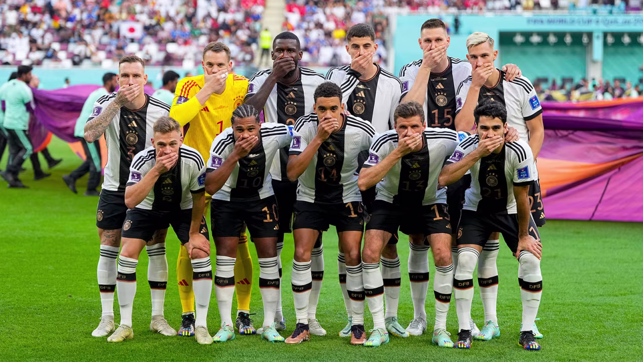 German players pose with hands in front of their mouths prior to the match against Japan on November 23. 