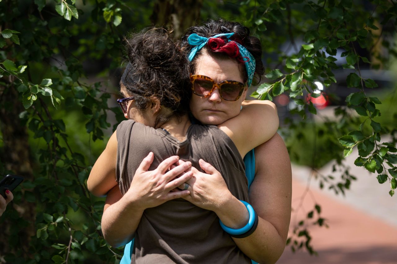 Courteney Ross, girlfriend of George Floyd, embraces another woman shortly after the sentencing of Chauvin on June 25.