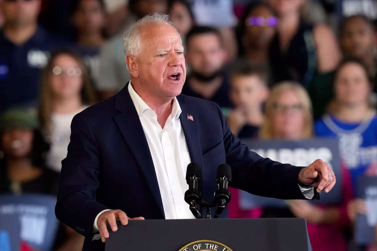 Democratic vice presidential nominee Gov. Tim Walz speaks at a campaign rally in Romulus, Michigan, near Detroit, on August 7. 