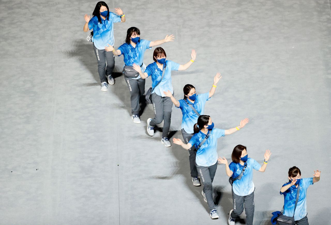 Volunteers are seen during the closing ceremony in Tokyo on August 8, 2021.